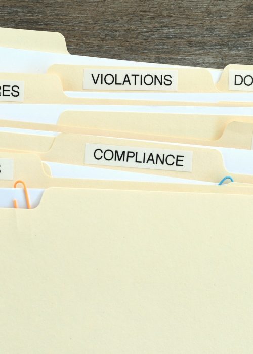 File Folders with words Compliance, Policies, Regulations, Violations, Procedures and Documentation File Folders with words Compliance, Policies, Regulations, Violations, Procedures and Documentation
