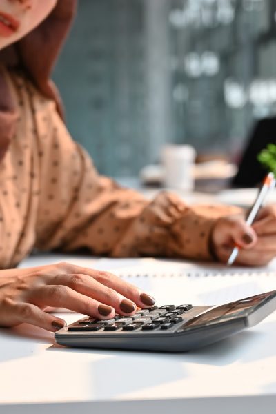 Islam woman working with finance calculate on calculator. Islam woman working with finance calculate on calculator.